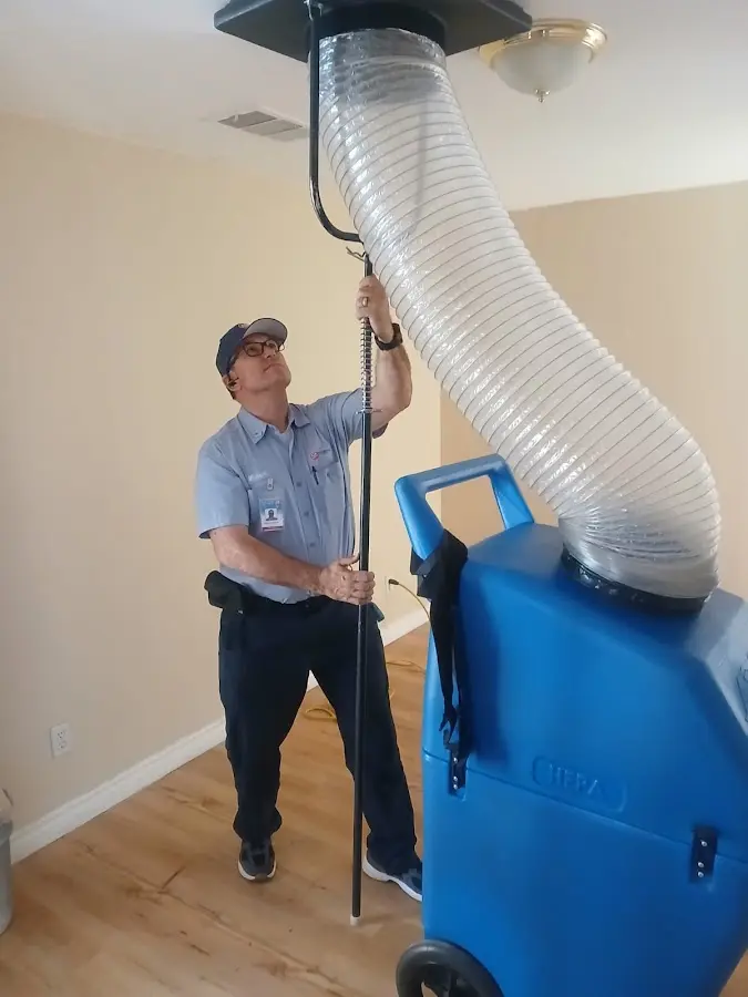 Furnace Tune-Up technician using HEPA equipment in Fallston